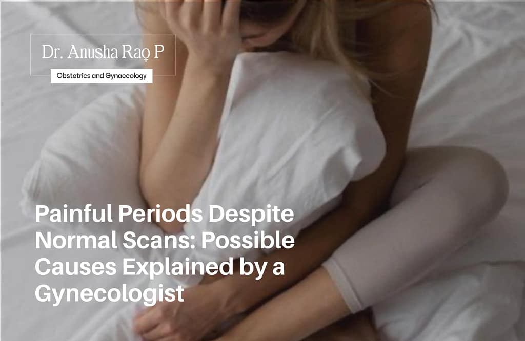 Woman sitting on a bed holding her lower abdomen in pain, representing painful periods despite normal scans, with a gynecologist explaining possible causes.